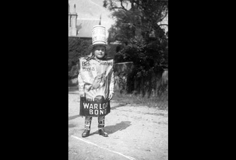 Lindsay Goulding is photographed dressed as a war bond, with the slogan ‘Before sunset buy a war loan bond’. He won first prize for the most original costume design at a Red Cross fete in Northwood, New South Wales in 1918. Established nine days after the outbreak of the First World War, the Australian Red Cross provided key medical supplies and equipment to Anzac troops during the war and assisted the servicemen upon their return.