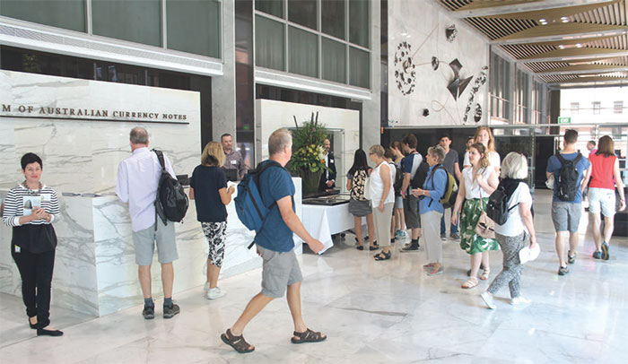 (Image top) Pat Woolley, whose husband Ted Roberts wrote the lyrics to the conversion jingle, with Kevin Golsby, the voice of the animated character Dollar Bill, at the decimal currency event, February 2016; (image above) Head of Information Department Jacqui Dwyer (left) with visitors to the Reserve Bank of Australia Museum during Sydney Open, November 2015